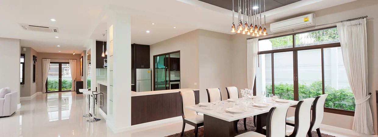 Open dining and living area with large windows